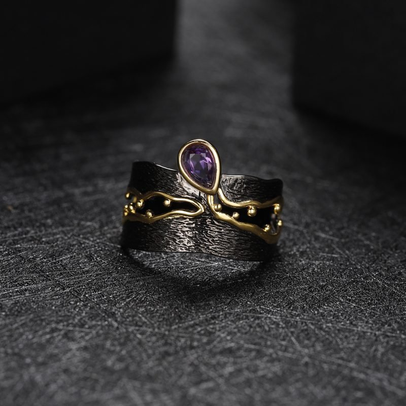 Wide black ring set with amethyst