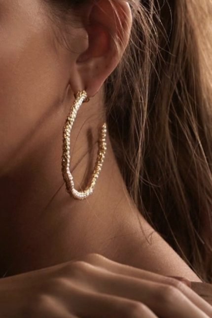 Large gold hoop inlaid with pearls